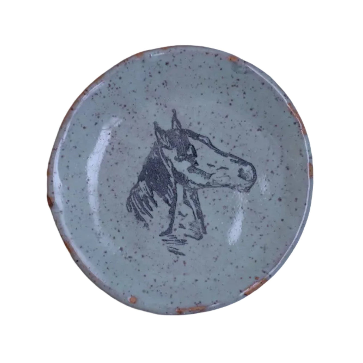 Small ceramic plate with a horse design on a white background