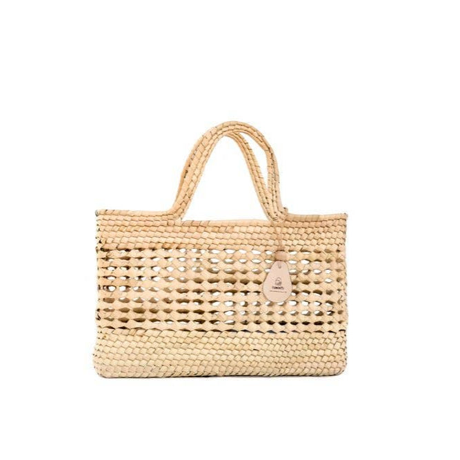 Square woven palm fiber basket with flat bottom and sturdy handles, a structured tote that stands upright on its own. Perfect for Farmers Market runs