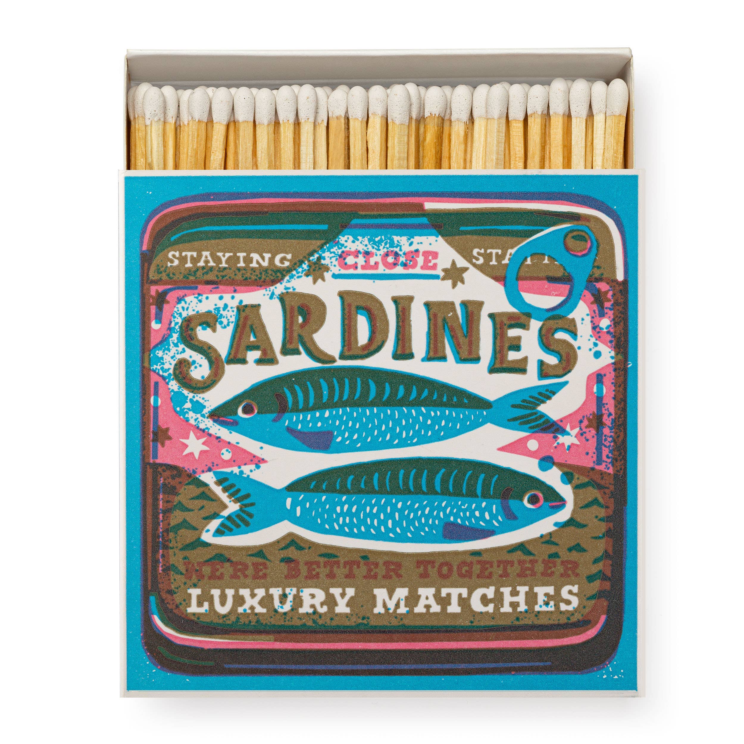 Vintage sardine tin matchbox with retro 'Staying Close' artwork, filled with long strike-on-box matches.