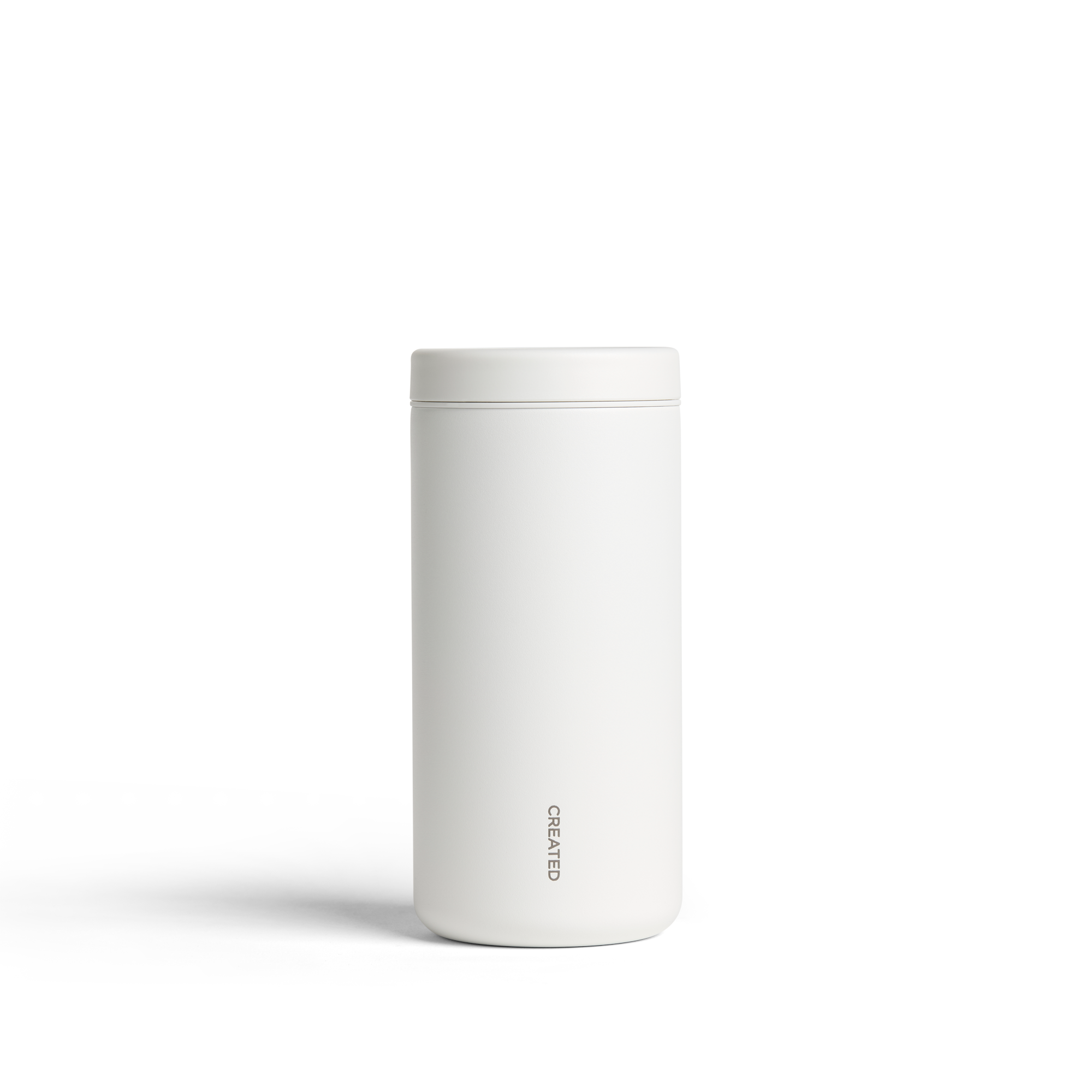 White 12oz Nomad tumbler with 360° sip lid, twist-open for easy drinking, reseals securely, perfect for hot or cold drinks.