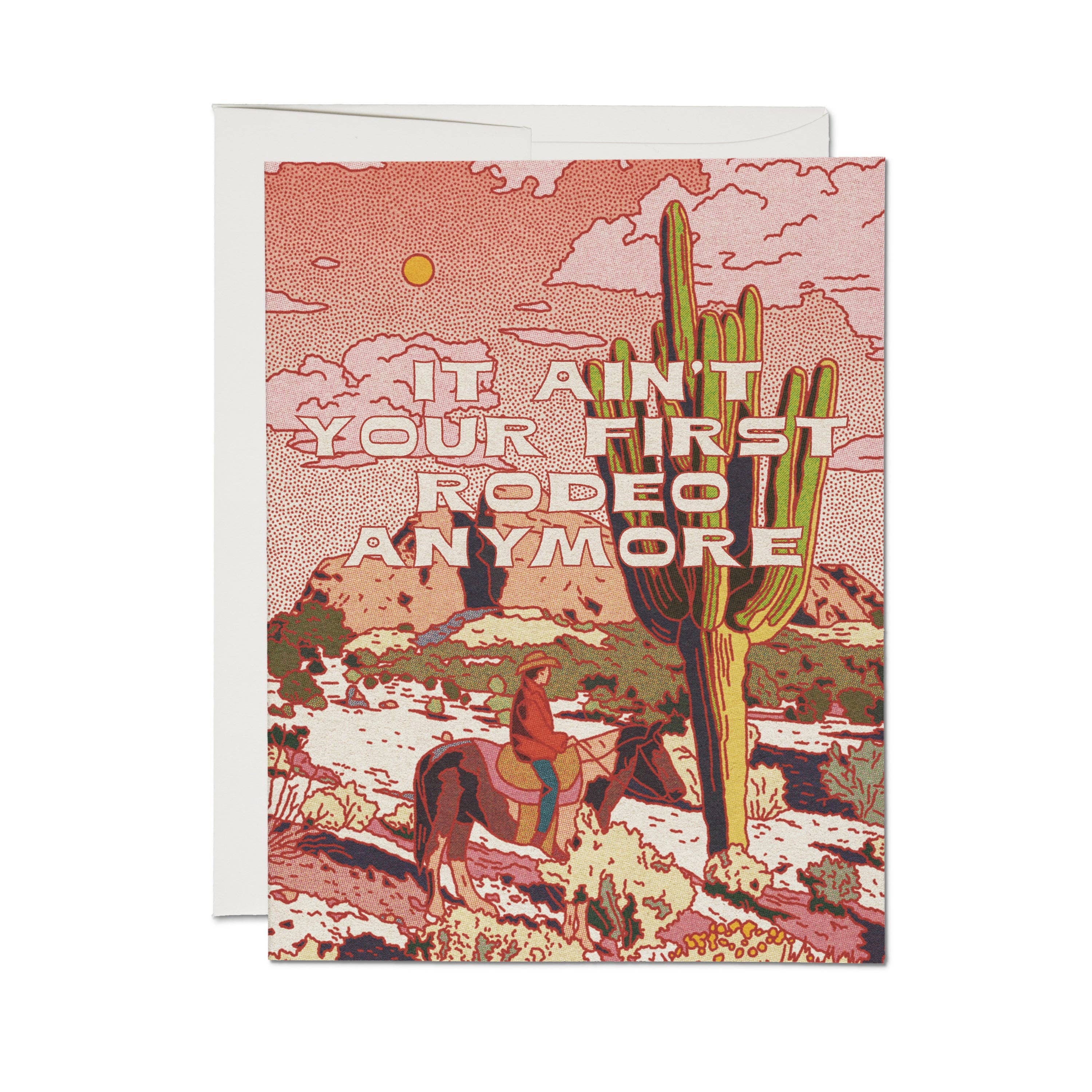 Greeting card with desert scene, cactus, and text 'It ain't your first rodeo anymore' on a white background.