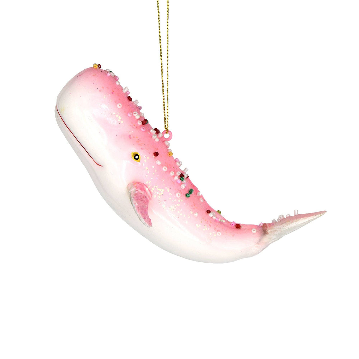 A pink and white whale-shaped hanging ornament with small bead details and a gold hanging string, shown against a plain white background.