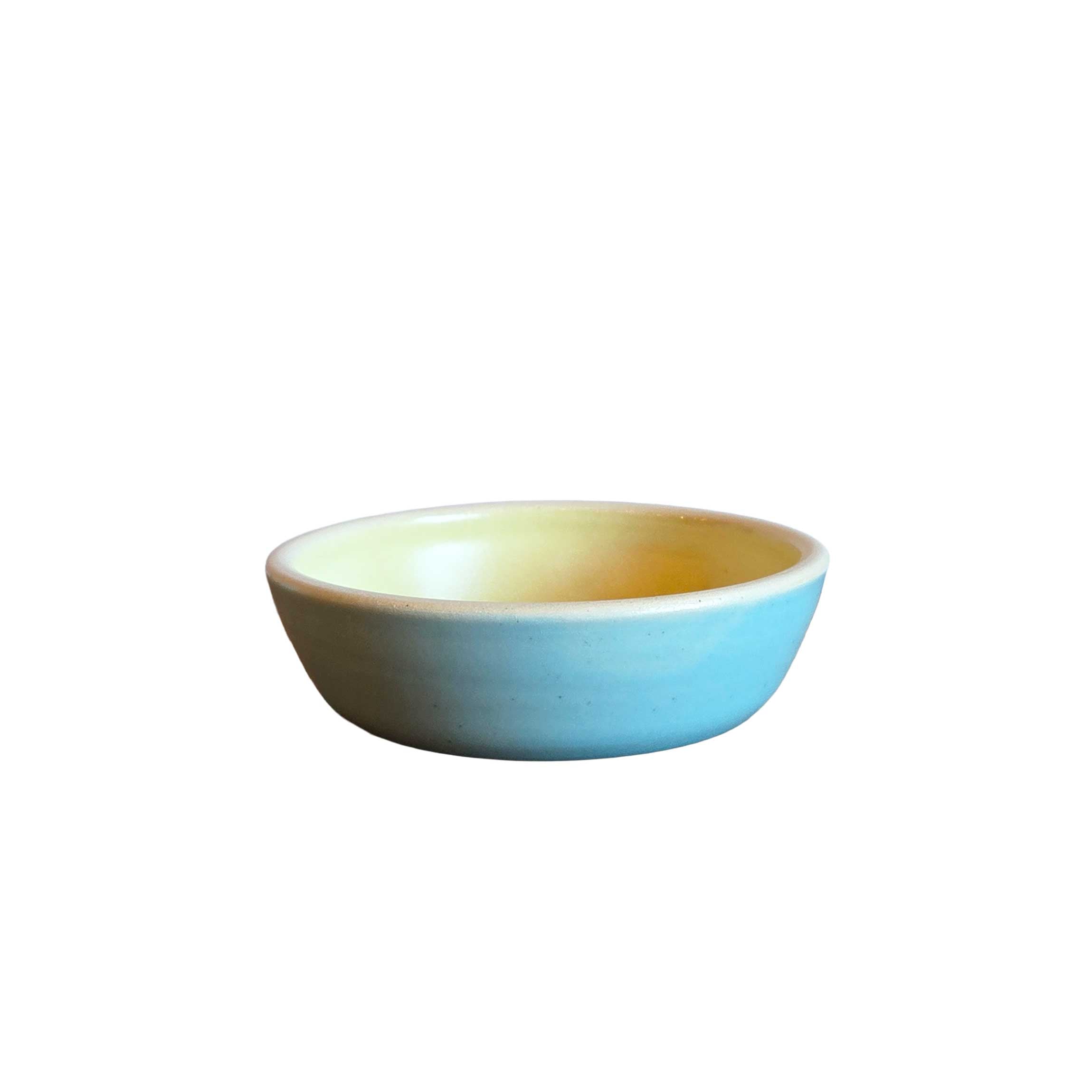 Handmade ceramic sauce bowl, 4x1 in, sky blue outside with butter yellow interior, stackable and perfect for dips or sauces.