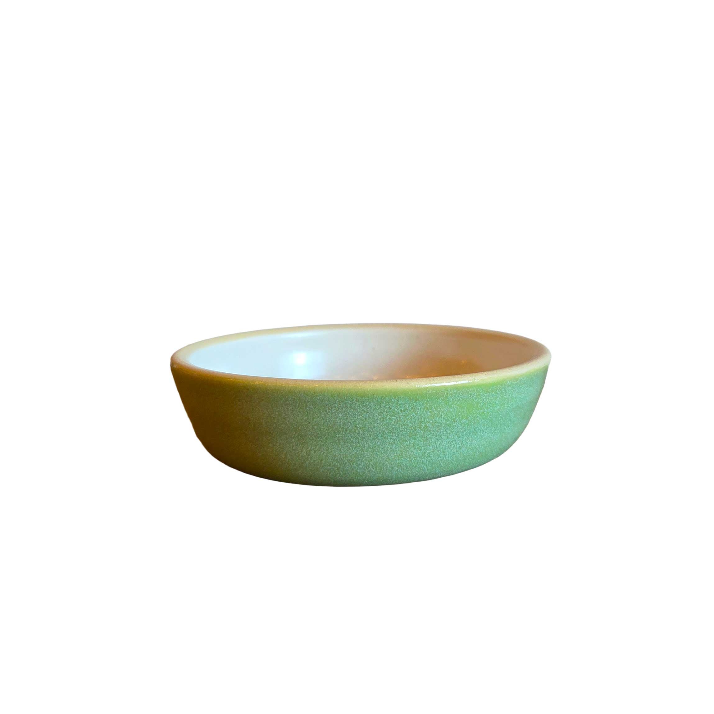 Handmade ceramic sauce bowl, 4x1 in, soft green outside with white interior, stackable and perfect for dips or sauces.