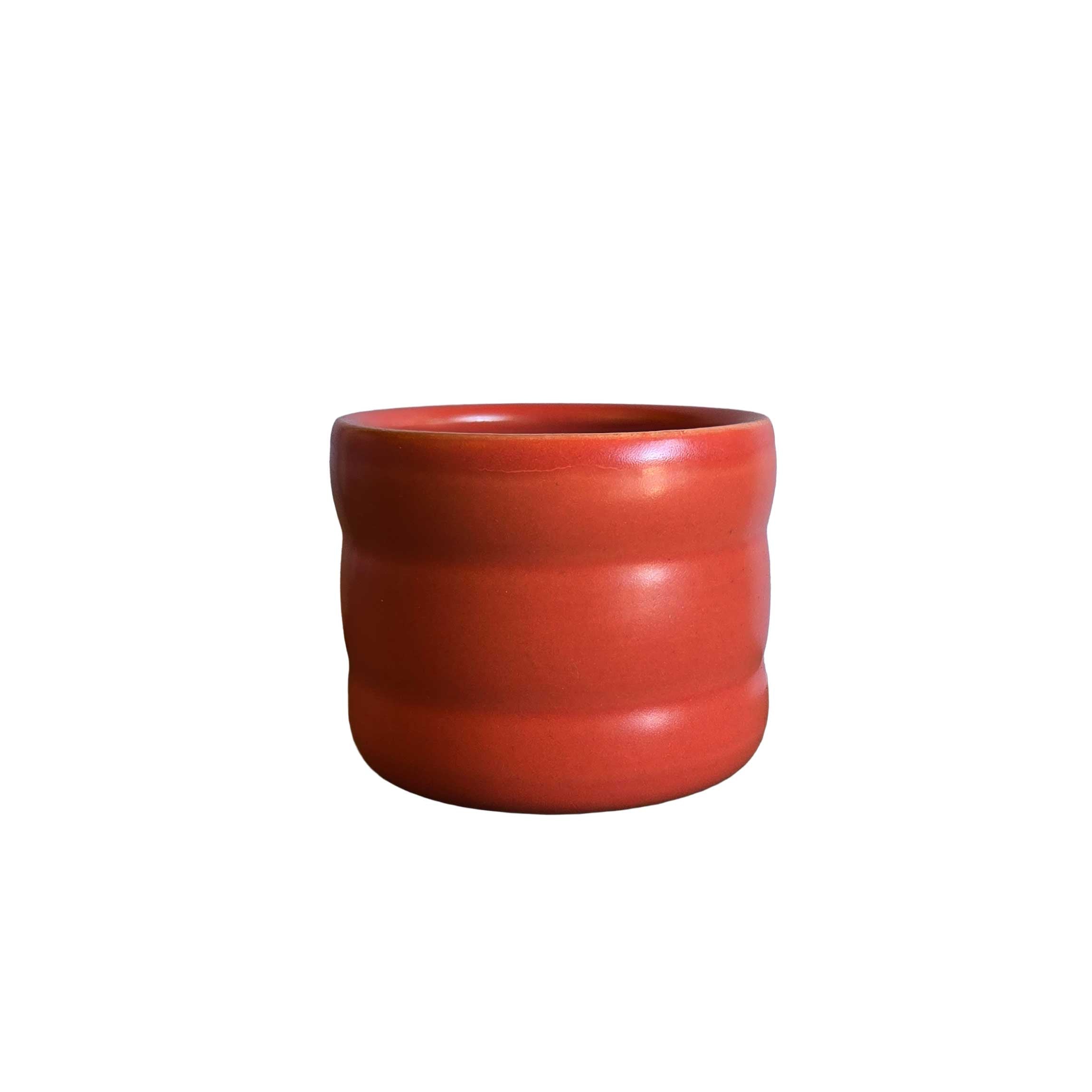 Wiggly tumbler in bright red, 6oz ceramic cup with sculptural curves, ideal for wine, cocktails, or vibrant table settings.
