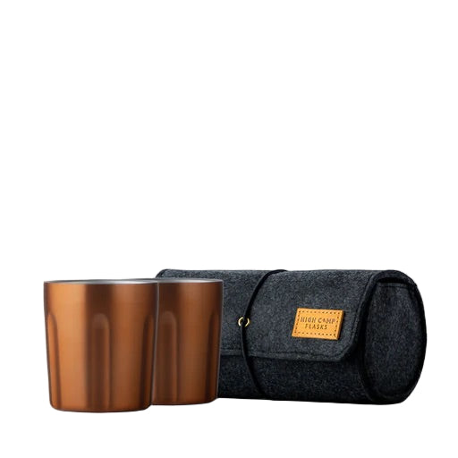 Copper Firelight tumbler 2-pack, 10.5oz each, with wool felt case, perfect for picnics, camping, or sharing drinks outdoors.