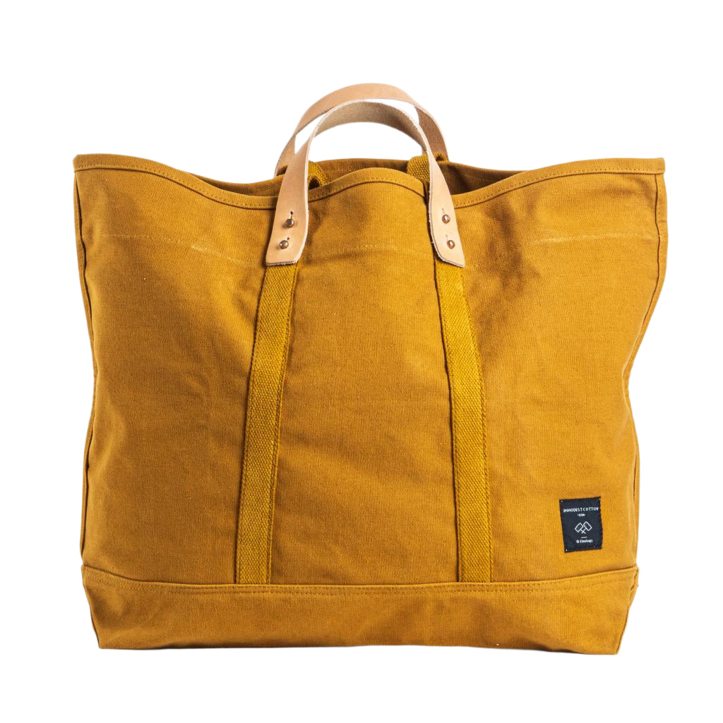 Large mustard seed yellow canvas tote bag with sturdy handles, spacious design for everyday use or travel.