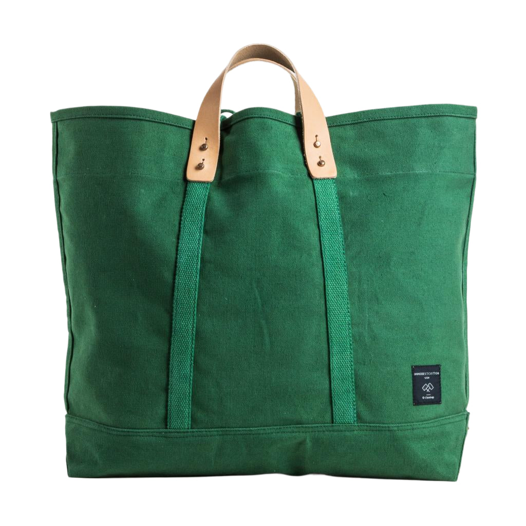 Large tote bag in pine green canvas with sturdy handles, spacious design ideal for work, school, or daily commutes.