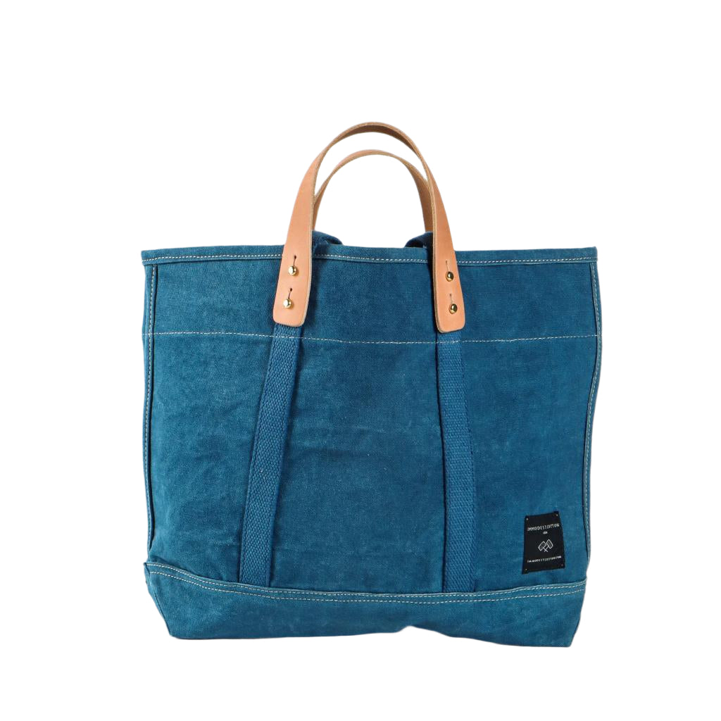 Small Indigo canvas tote bag with short handles, compact size ideal for everyday use or short trips.