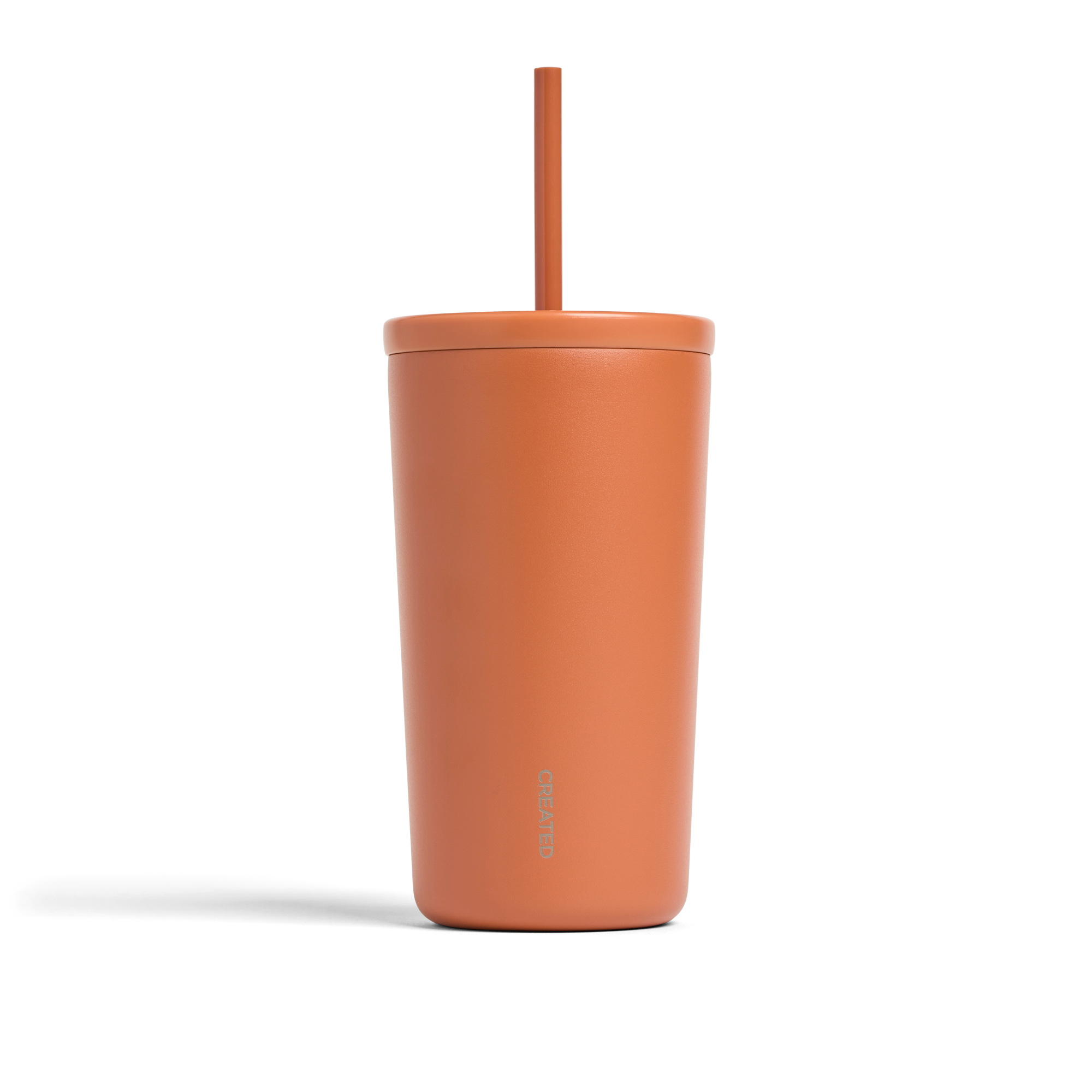 Terracotta colored, 16 oz Cold Cup with twist lid and reusable straw, BPA-free, no-sweat finish, keeps drinks hot or cold.