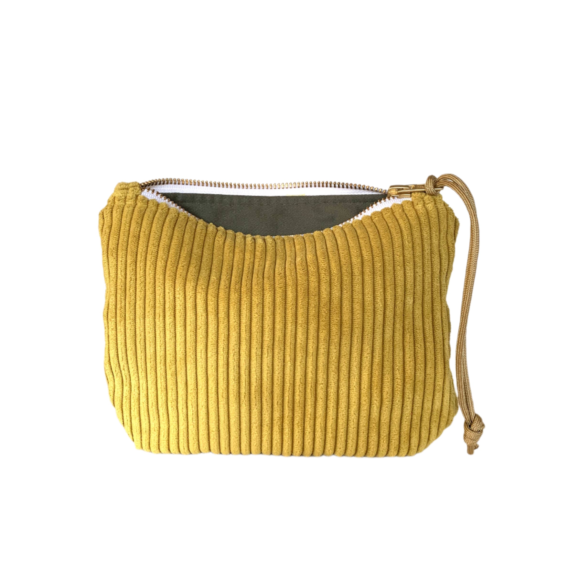 Chartreuse green corduroy clutch with zipper closure, soft textured bag for traveling or day use.