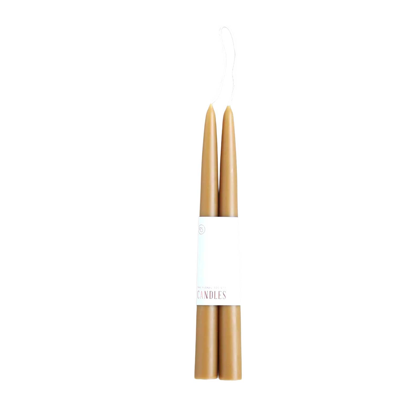 Pair of 12-inch honey colored dipped taper candles with 12-hour burn time, elegant for dining, décor, or gifting.
