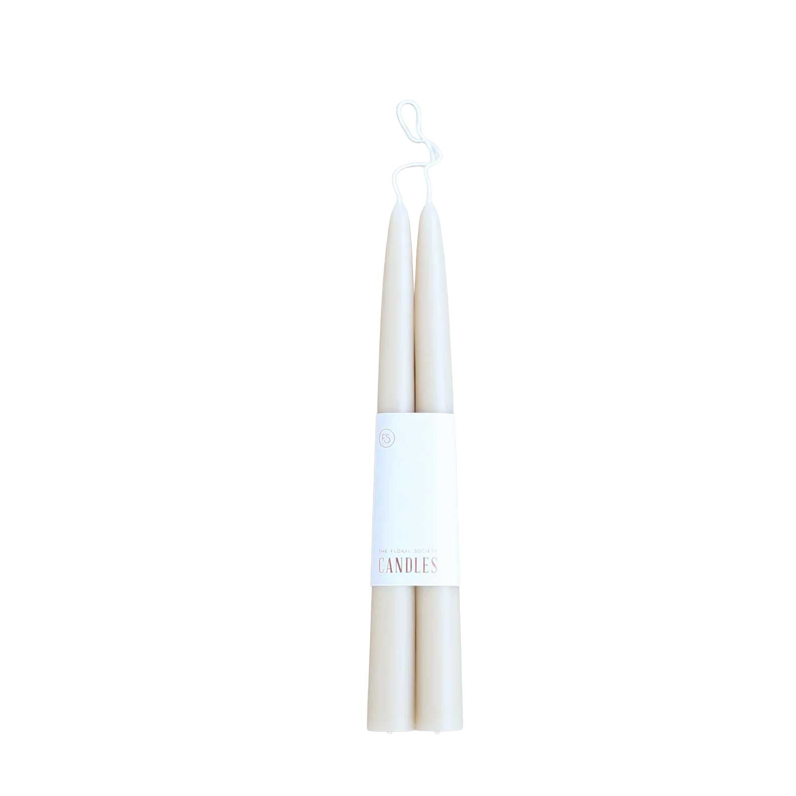 Pair of 12-inch soft partchment colored dipped taper candles with 12-hour burn time, elegant for dining, décor, or gifting.