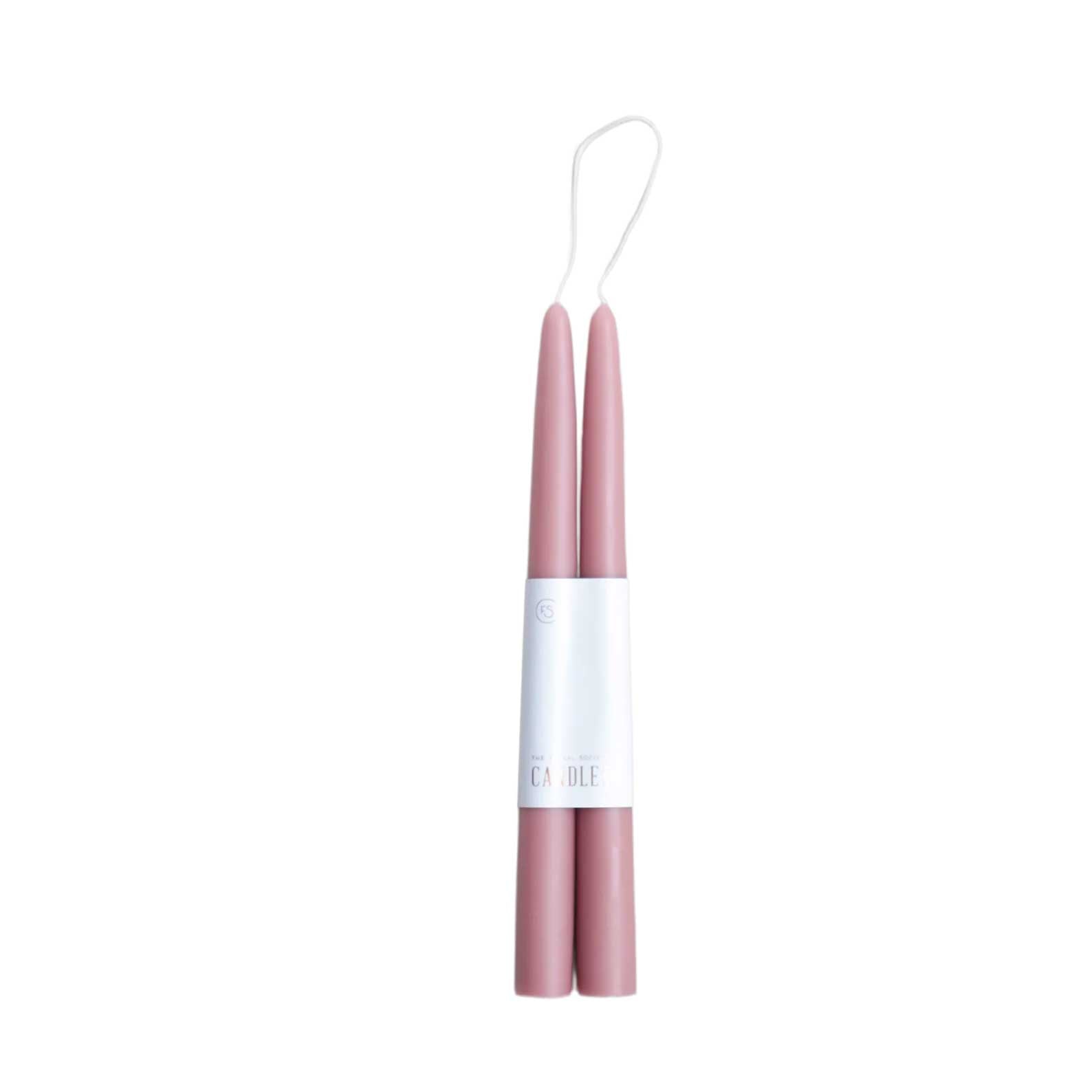 Pair of 12-inch rose colored dipped taper candles with 12-hour burn time, elegant for dining, décor, or gifting.
