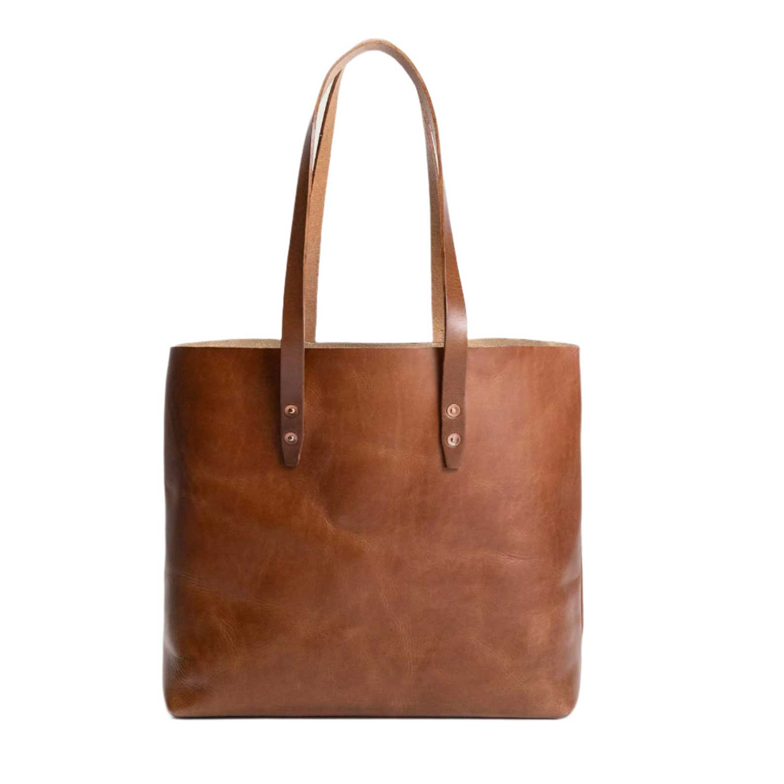 Leather simple tote bag in tan with sturdy handles, timeless spacious design for work, travel, or everyday carry.