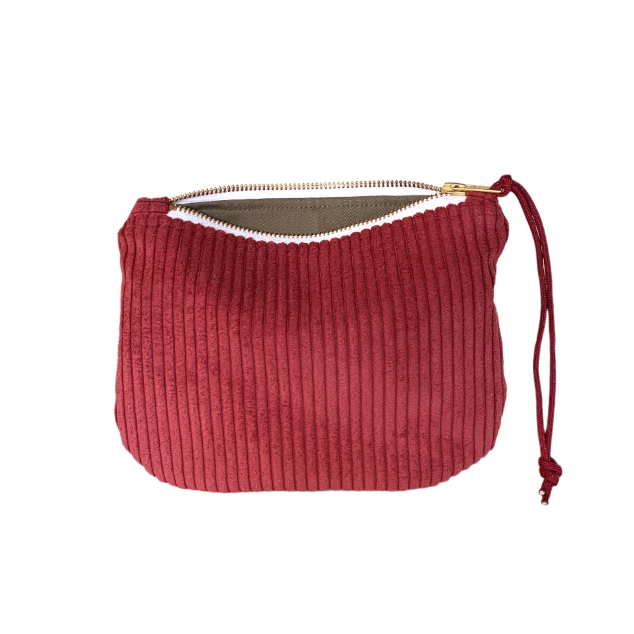 Corduroy clutch in merlot red with zipper closure, soft textured bag for carrying essentials or school supplies.