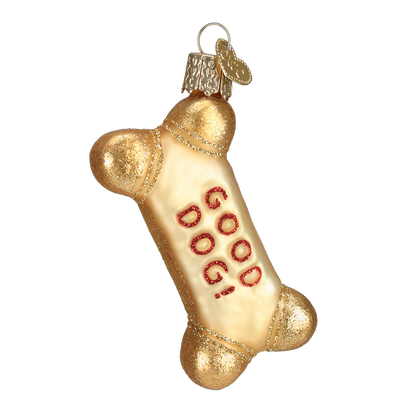 A bone-shaped Christmas ornament with a metallic gold glitter finish and the word 'DOG GOOD!' written in red glitter on the center, shown on a plain white background.