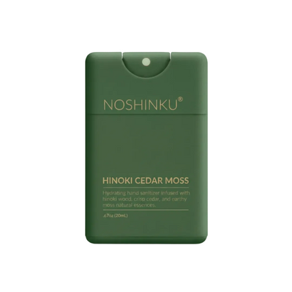 Noshinku Hinoki Cedar Moss hand sanitizer in a dark green rectangular bottle with gold lettering, shown on a clean white background.