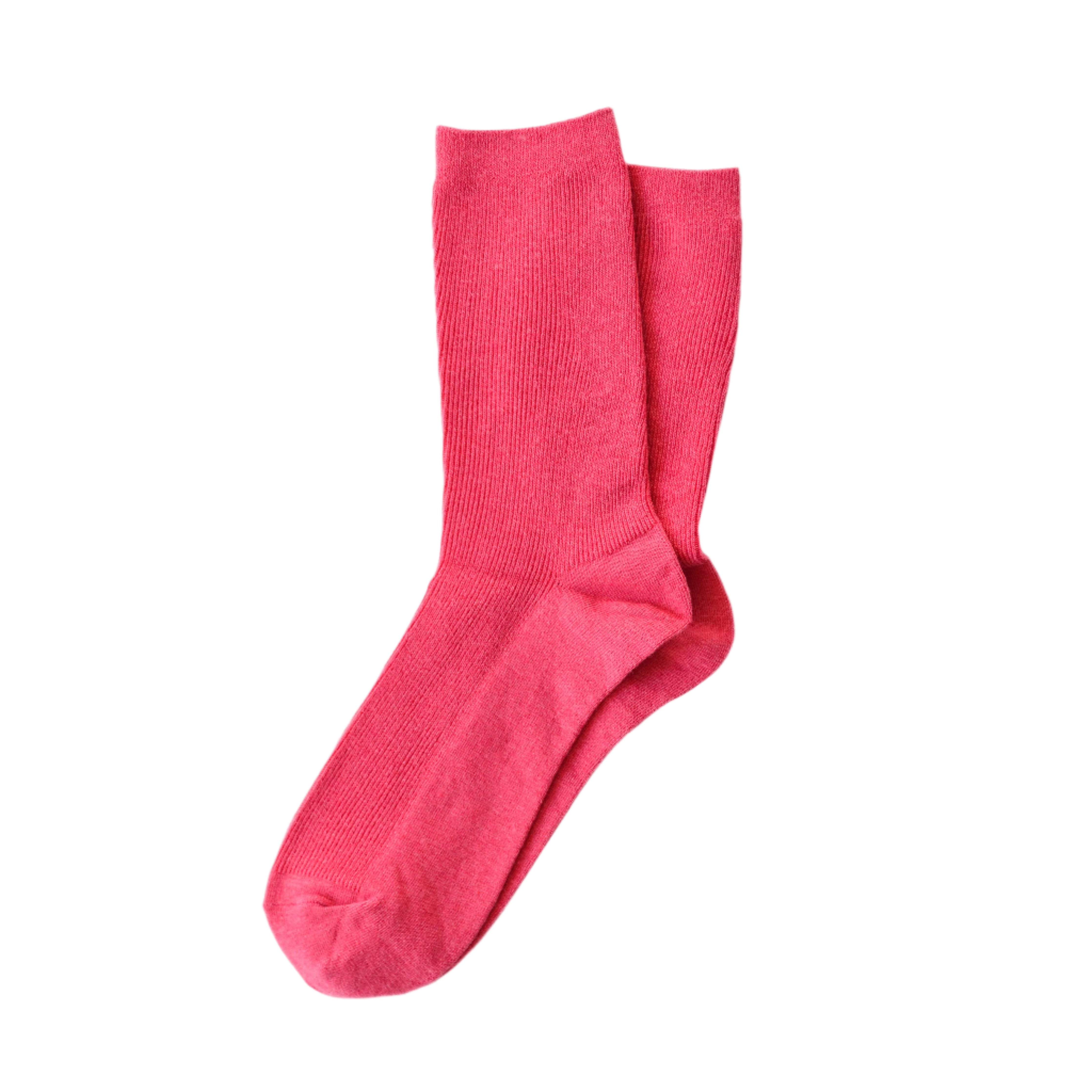 Fuchsia cotton crew socks in a bold solid color, perfect for adding a playful pop to everyday outfits.