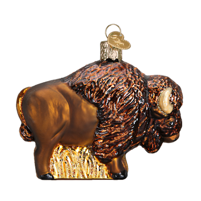 Glass ornament of a bison on a white background