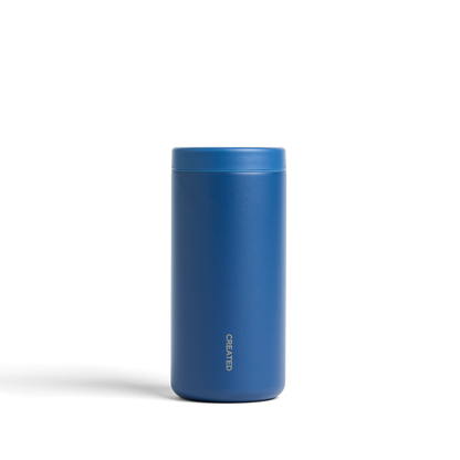 Pacific blue 12oz Nomad tumbler with 360° sip lid, twist-seal design, perfect for road trips, camping, or outdoor drinks.