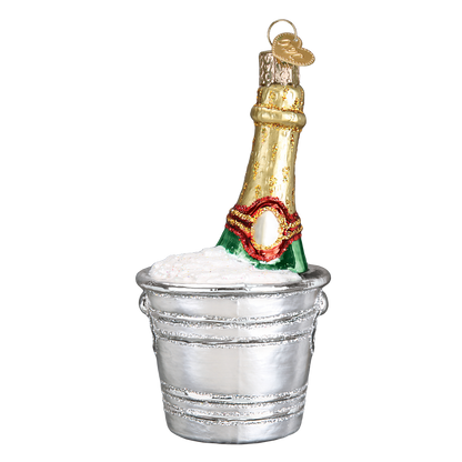 A champagne bottle ornament nestled in a silver bucket, shown on a plain white background.
