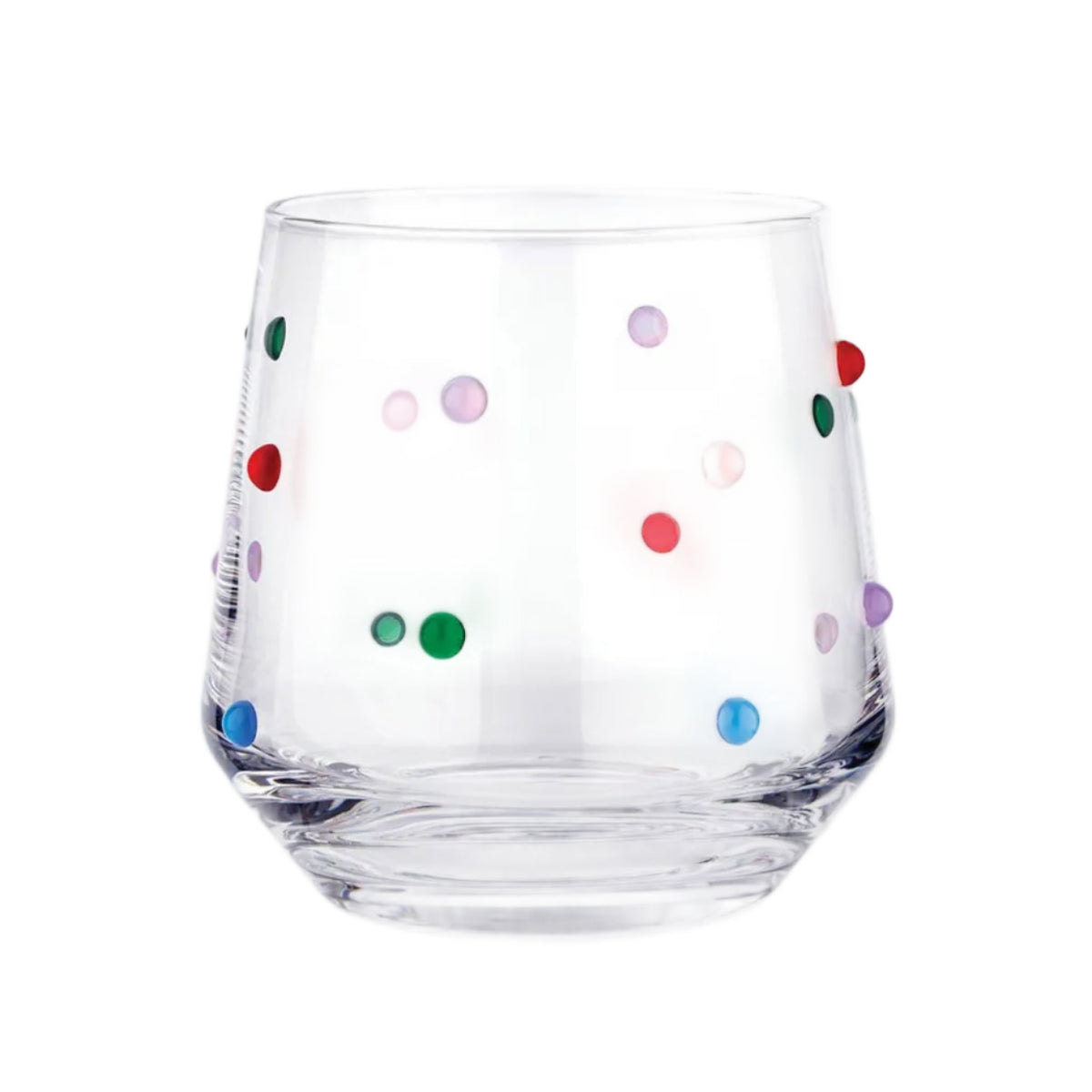 Clear glass tumbler with colorful polka dots on a white background