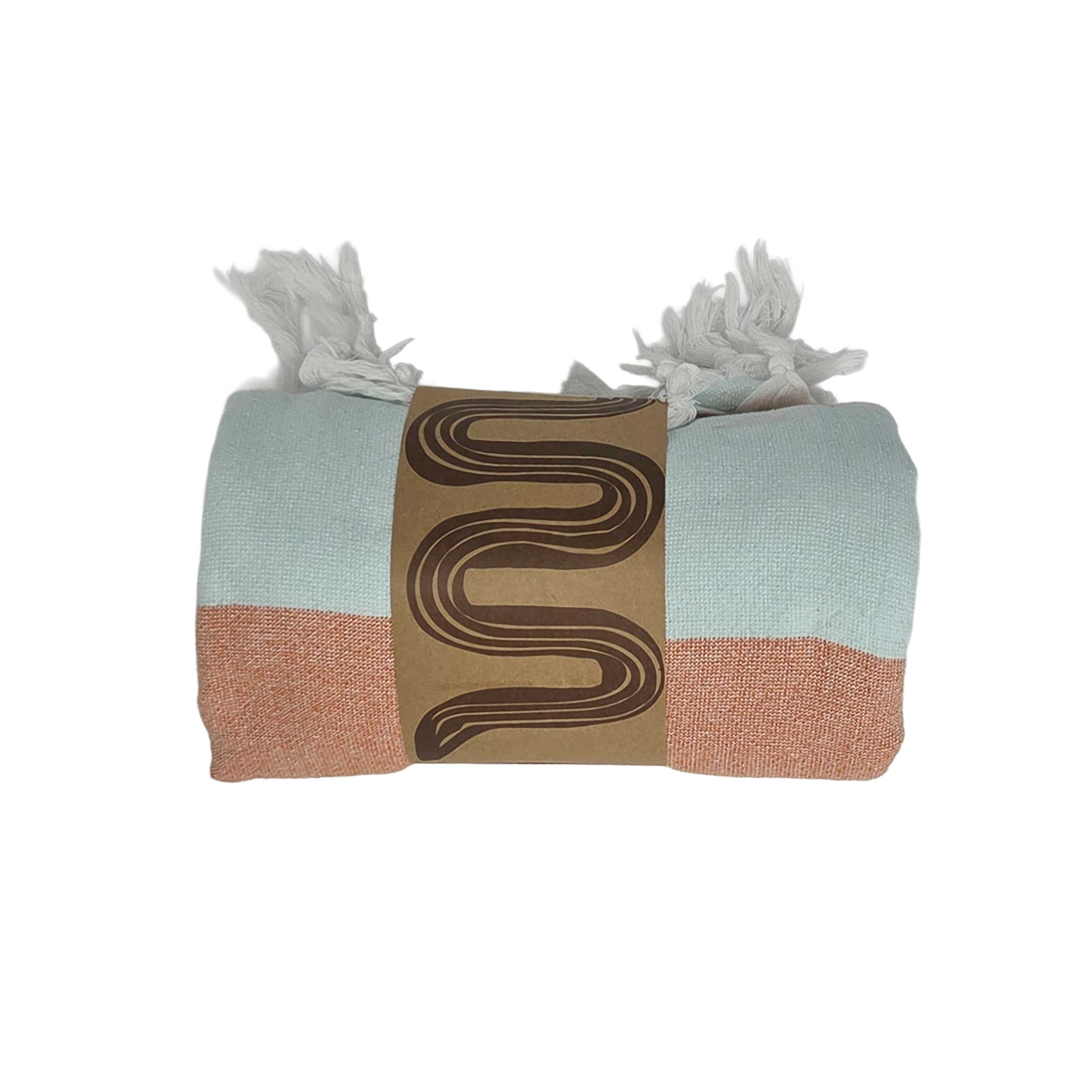 Lightweight, fast drying towel in light blue and orange stripes with tasseled edges. Perfect for beach days