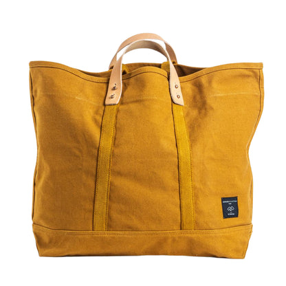 Large mustard seed yellow canvas tote bag with sturdy handles, spacious design for everyday use or travel.