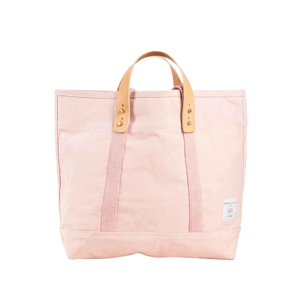 Small tote bag in bubblegum pink canvas with short handles, compact size for daily essentials or errands