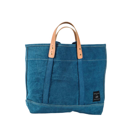 Small Indigo canvas tote bag with short handles, compact size ideal for everyday use or short trips.