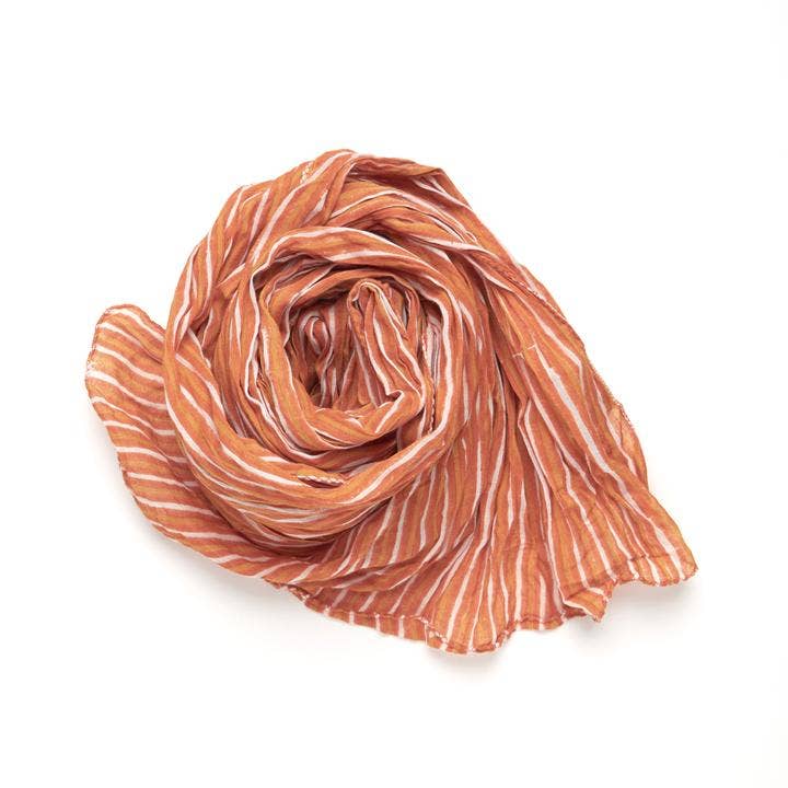 Fair trade made Paris Stripe scarf in tangerine tones, 20x80 inches, lightweight accent for travel, layering, or summer evenings.