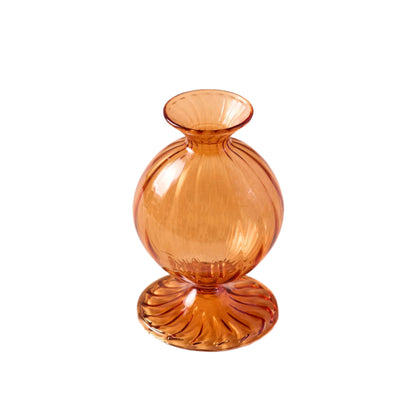 Hand-molded borosilicate glass bud vase with an amber orange rich hue, perfect for small flower stems or pop of color decor