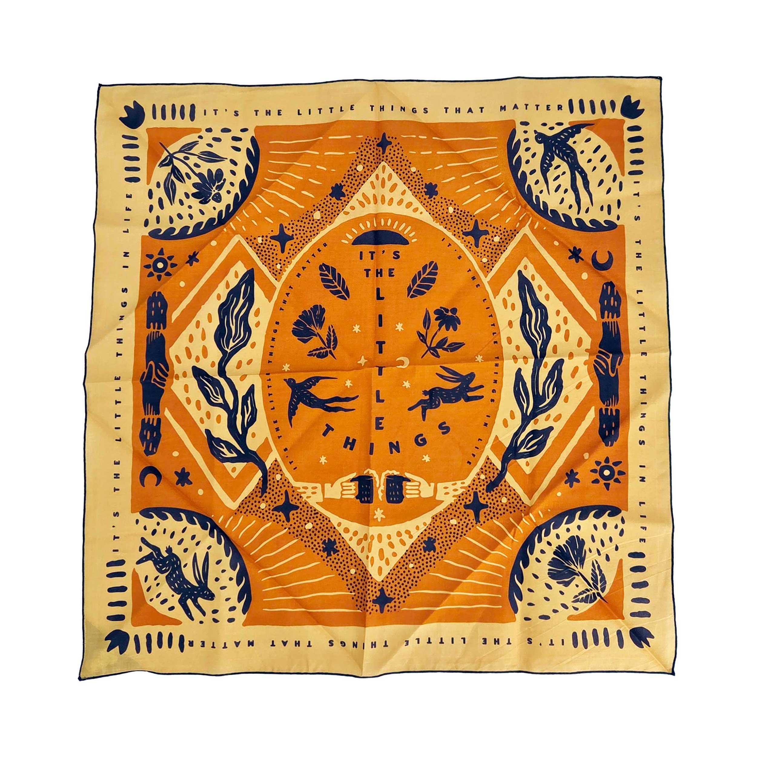 Square bandana with Southwestern flora, desert animals, and 'it’s the little things' script down the center.