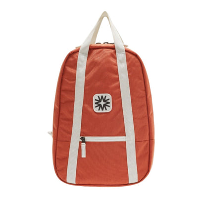 Arrow Pack backpack in coral canvas with adjustable straps, vibrant everyday bag for commuting, school, or travel.