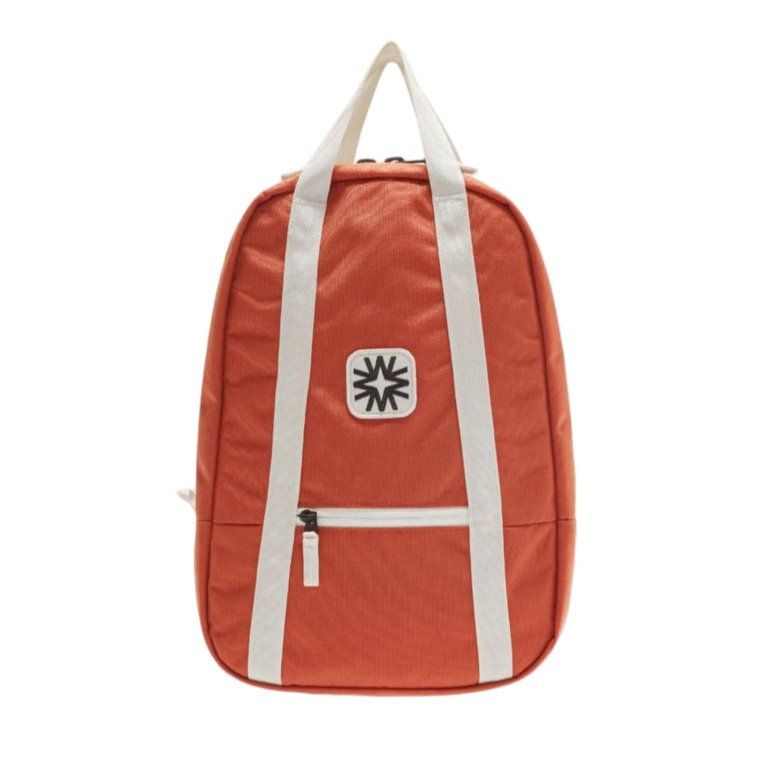 Arrow Pack backpack in coral canvas with adjustable straps, vibrant everyday bag for commuting, school, or travel.