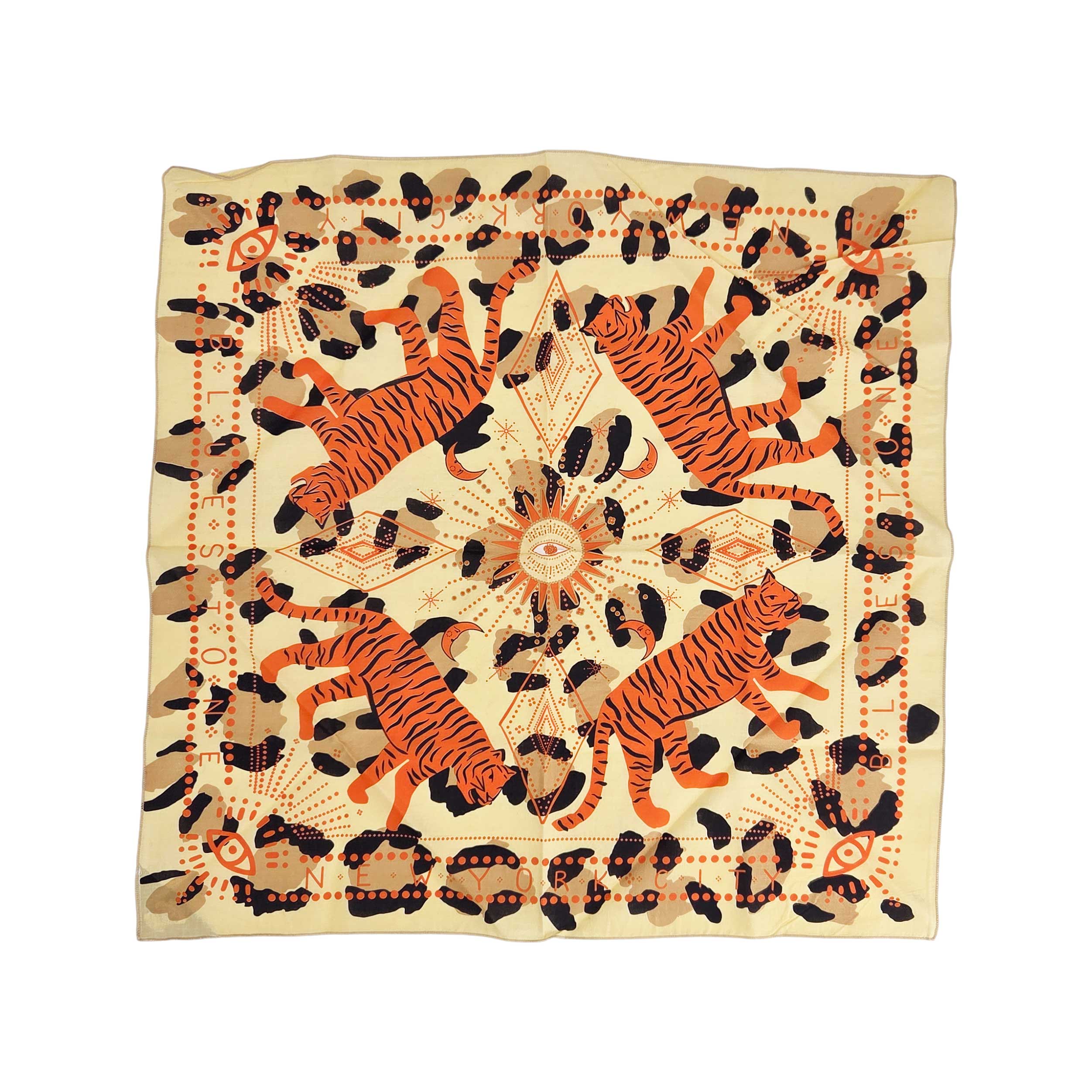 Light brown square bandana accessory with cheetah print and cheetah illustrations, versatile for wear or styling.