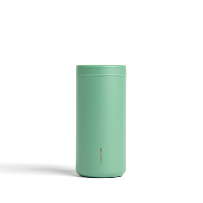 Sage green 12oz Nomad tumbler with 360° sip lid, secure twist seal, ideal for daily use or traveling.