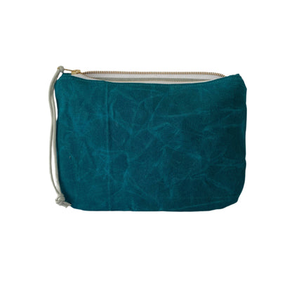 Waxed canvas clutch in marine blue with zipper closure, compact durable design for carrying essentials or travel.