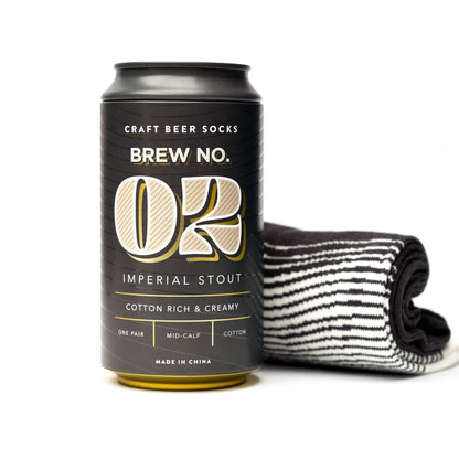 Brew No. 02 Imperial Stout socks in a matte beer can with gold and silver accents, cotton striped mid-calf socks inside. Fun for any beer lover!