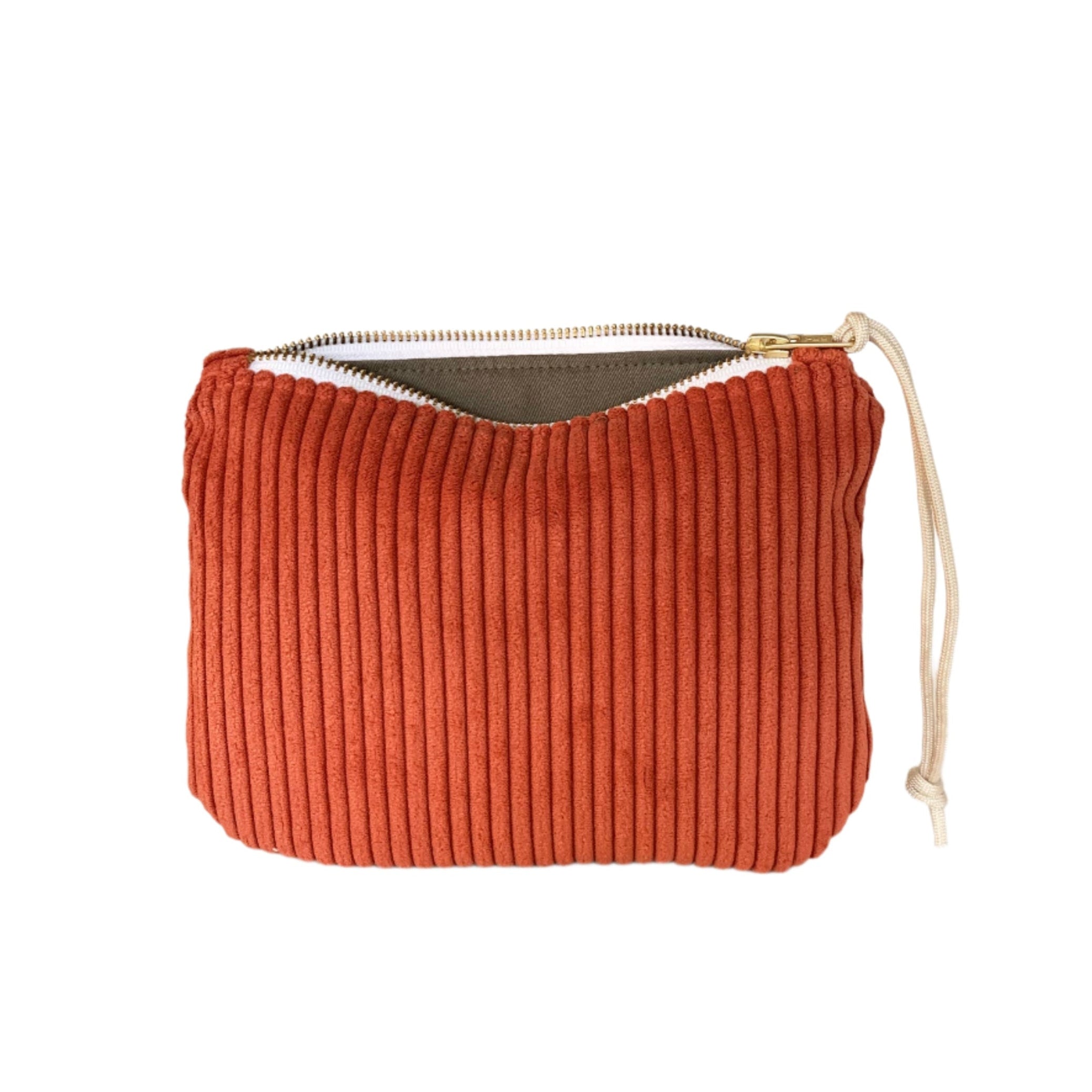 Corduroy clutch in poppy red with zipper closure, soft textured bag perfect for daily essentials or traveling.