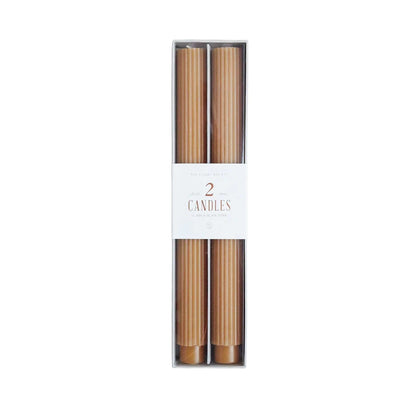 Pair of 10-inch hand molded ribbed taper candles in golden honey color, long-lasting with up to 10 hours burn time each.