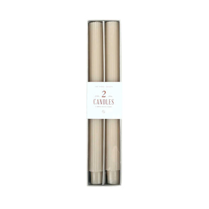 Pair of 10-inch ribbed taper candles in warm partchment tone, long-lasting with up to 10 hours burn time each.