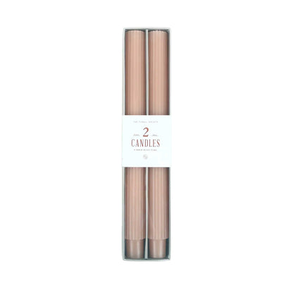 Pair of 10-inch ribbed taper candles in a blush pink, long-lasting with up to 10 hours burn time each.