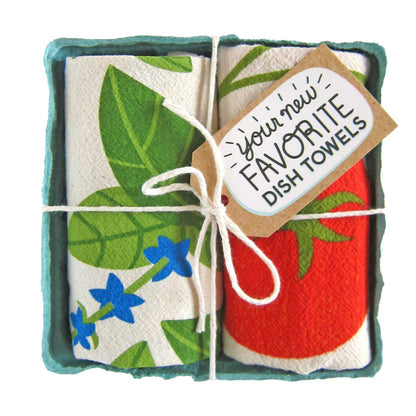 Pair of cotton tea towels with vibrant basil leaves and juicy tomato prints, eco-friendly, packed in a produce-style container. Cute addition to any kitchen