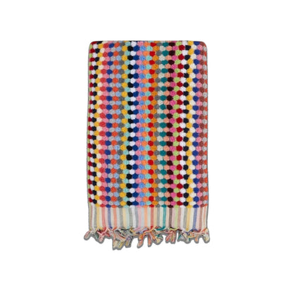 Colorful Turkish cotton bath towel with bubble pattern and fringe, lightweight, absorbent, perfect for bath, beach, or pool.
