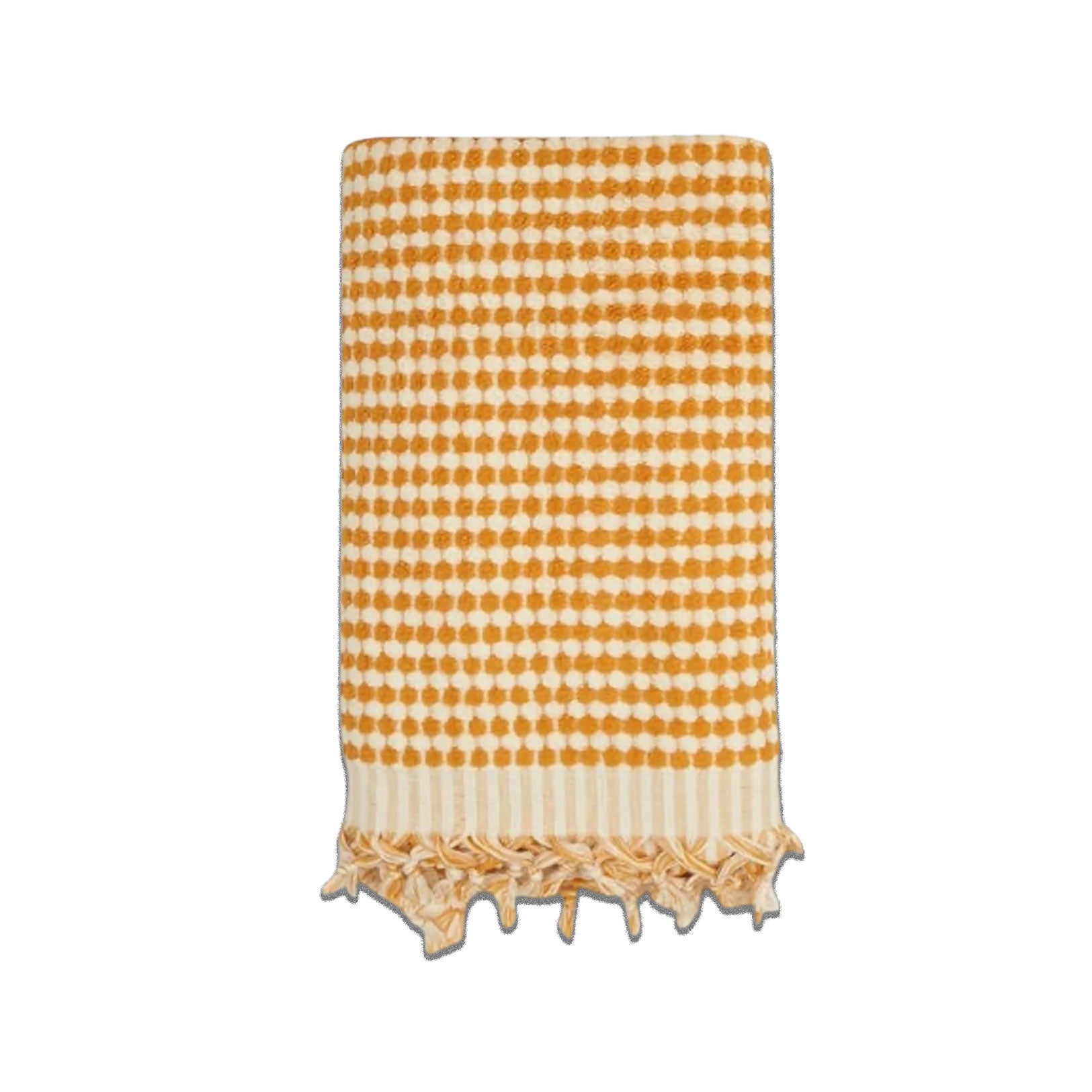 Mustard yellow and white Turkish cotton bath towel with bubble pattern and fringe, lightweight, absorbent, perfect for a beach day.
