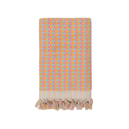 Pink and orange Turkish cotton bath towel with bubble pattern and fringe, lightweight, absorbent, perfect for a pool day or relaxing bath.